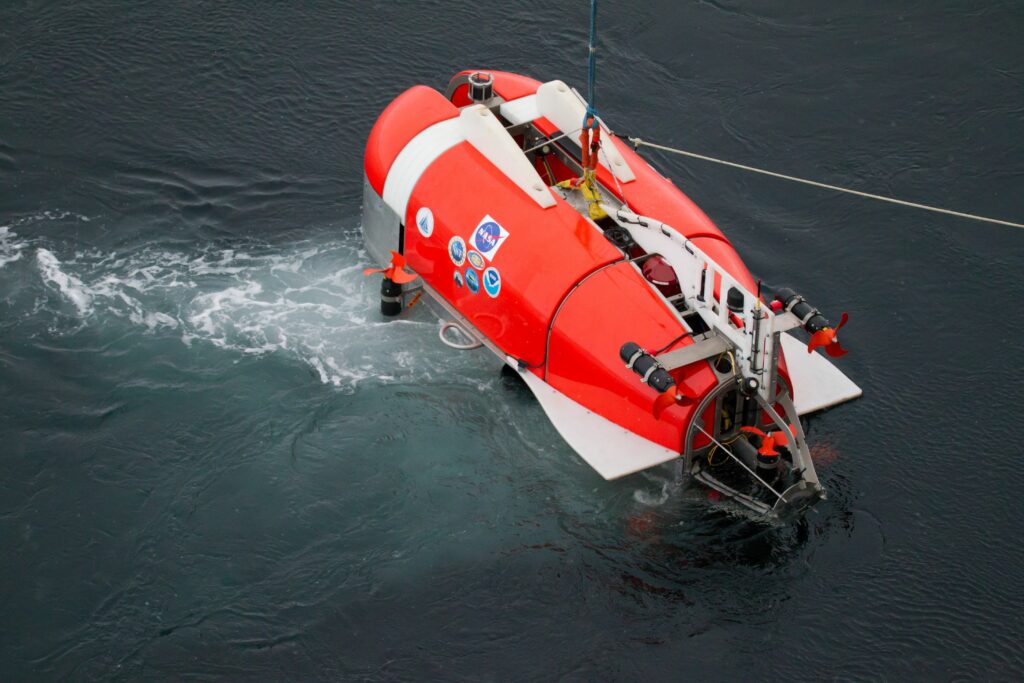 The NUI under-ice ROV is currently being lowered into the water.