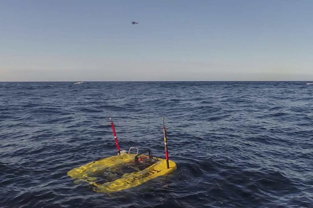 ROV Tramper surfacing from the water.